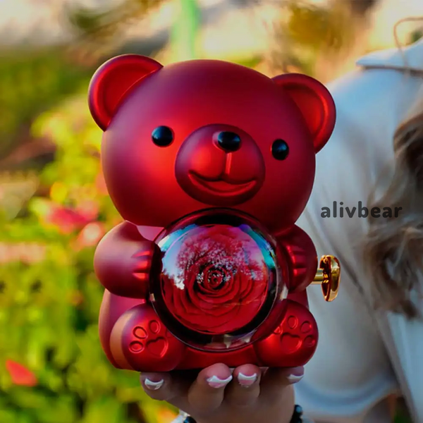 Скринька-ведмідь, що обертається, з трояндою в колбі